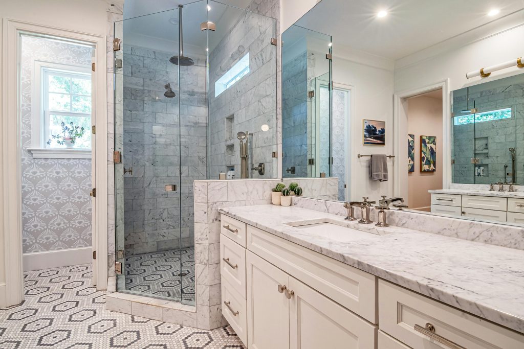 Luxurious bathroom with a freestanding bathtub, marble flooring, and rainfall shower in Cape Town